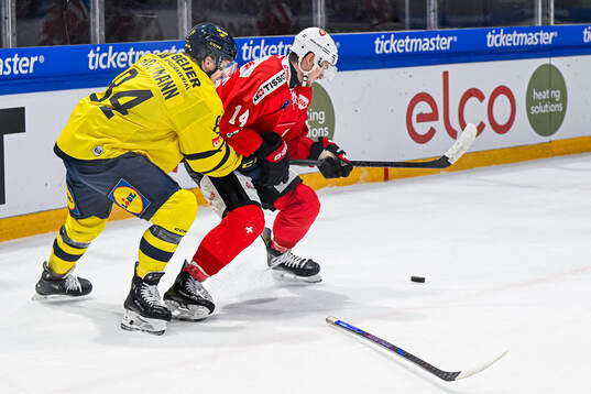 Sebastian Hartmann of Sweden and Dean Kukan of Switzerland