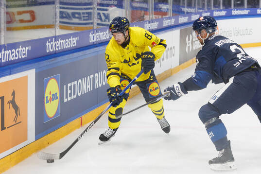 Jesper Frödén of Sweden in the ice hockey game between