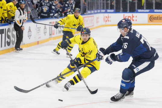 Fredrik Olofsson of Sweden in the ice hockey game between