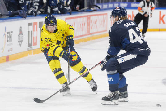 Jesper Frödén of Sweden in the ice hockey game between
