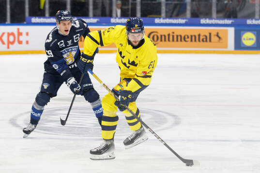 Theodor Lennström of Sweden in the ice hockey game between