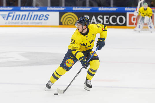 Jesper Frödén of Sweden in the ice hockey game between