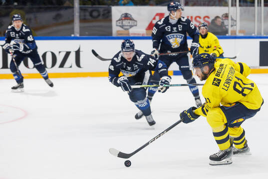Theodor Lennström of Sweden in the ice hockey game between