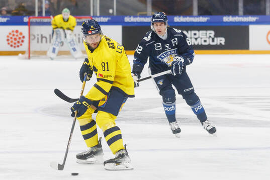 Theodor Lennström of Sweden in the ice hockey game between