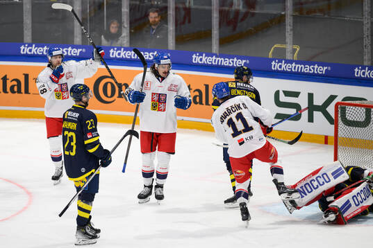 Players of Czech Republic celebrate  in the ice hockey game