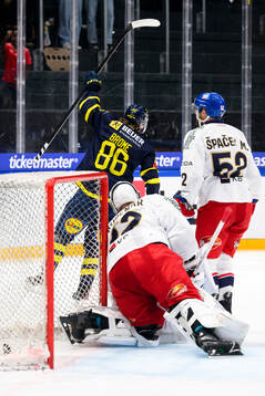Mathias Bromé of Sweden celebrates in the ice hockey game
