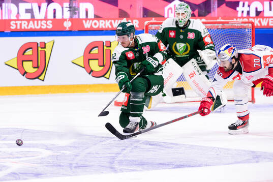 Magnus Nygren of Färjestad and Benjamin Nissner of EC Red
