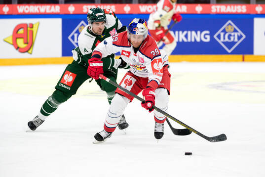 Henrik Björklund of Färjestad and Chay Genoway of EC Red
