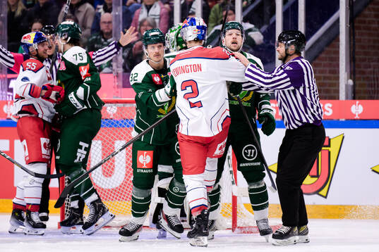 Magnus Nygren of Färjestad  and Tyler Lewington of EC Red
