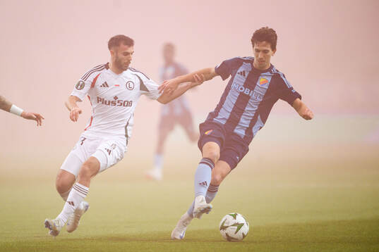Jurgen Celhaka of Legia Warszawa and Gustav Wikheim of