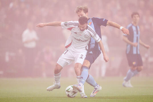 Jurgen Celhaka of Legia Warszawa and Daniel Stensson of