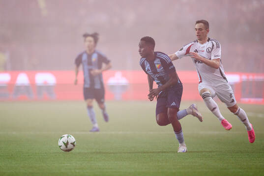 Tokmac Nguen of Djurgården and Kacper Chodyna of Legia