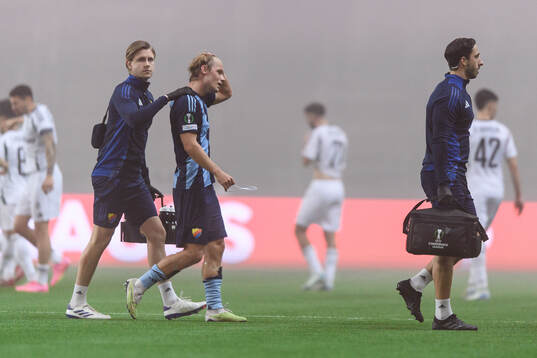 Tobias Gulliksen of Djurgården leaves the pitch injured