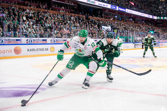 Rögles Brady Ferguson och Färjestads Jeremy Salvas Groleau