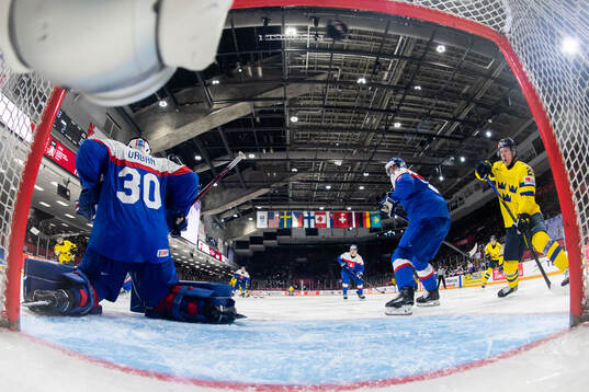 Axel Sandin-Pellikka of Sweden scores 1-3 behind goaltender