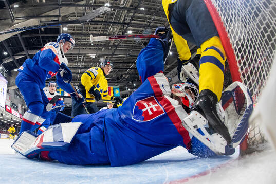 Peter Valent and goaltender Samuel Urban of Slovakia