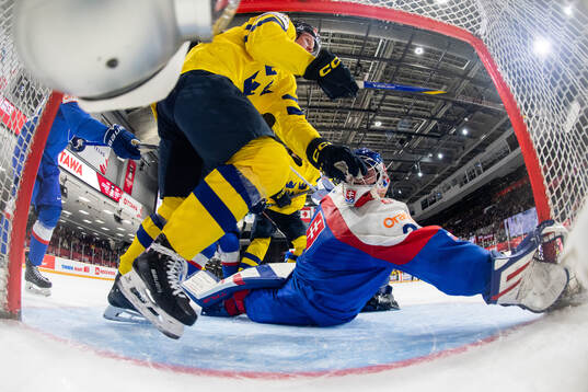 Otto Stenberg of Sweden and goaltender Samuel Urban of