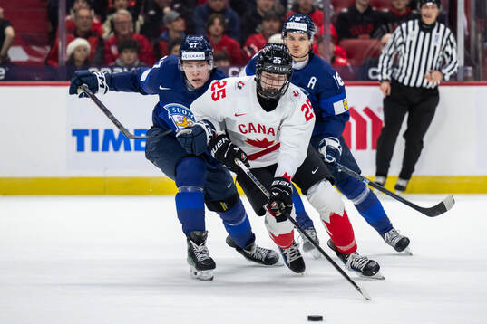 Julius Miettinen of Finland and Matthew Schaefer of Canada