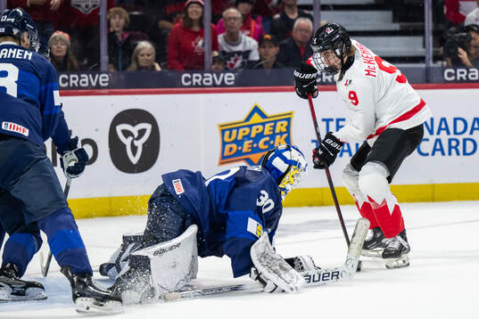 Gavin McKenna of Canada scores 0-1 behind goaltender
