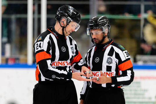 Domare Johan Magnusson och Domare Fredrik Rönnberg