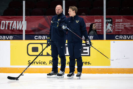Assistant coach Nicklas Grossmann and goaltender coach