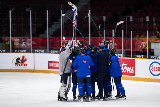 Players of Sweden celebrate at a practice session