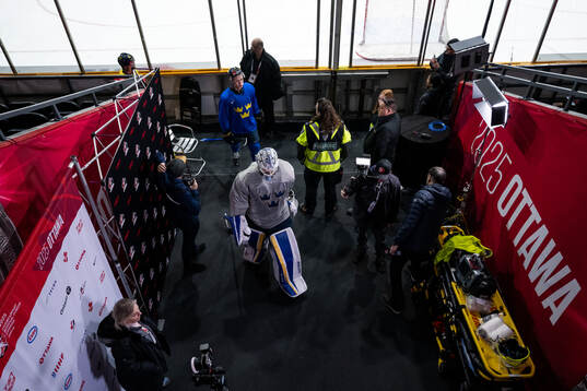 Wilhelm Hallquist and goaltender Marcus Gidlöf of Sweden