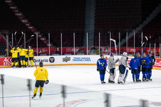 Players of Sweden celebrate at a practice session