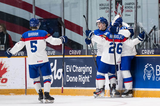 Daniel Jencko of Slovakia celebrates with team mates