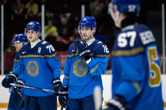 Semyon Simonov and Gleb Reshetko of Kazakhstan look dejected