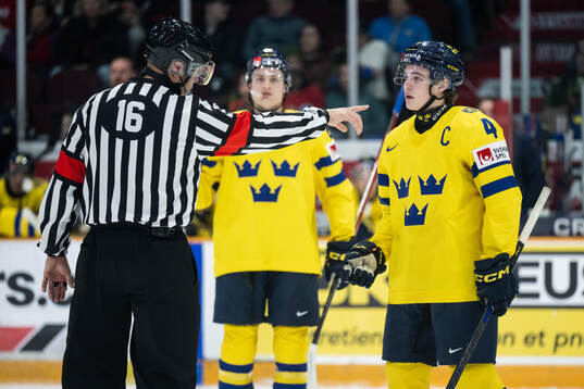 Axel Sandin-Pellikka of Sweden in a discussion with a