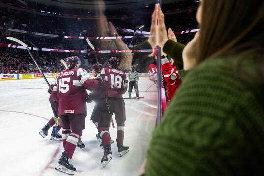 Davids Livsics of Latvia celebrates with team mates