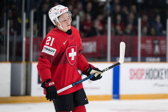 Ludvig Johnson of Switzerland looks dejected