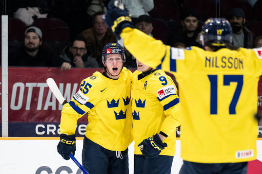 Otto Stenberg of Sweden celebrates with Theo Lindstein and