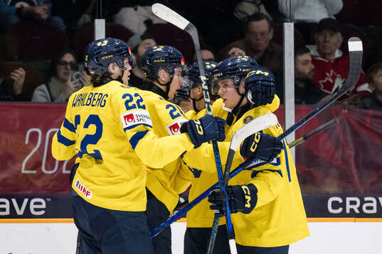 Otto Stenberg of Sweden celebrates with Anton Wahlberg,
