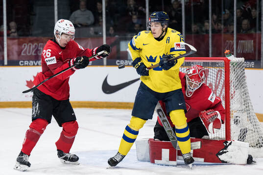 Eric Schneller and goaltender Christian Kirsch of
