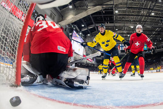 Herman Träff of Sweden celebrates while goaltender Elijah
