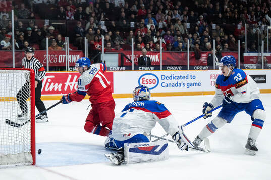 Pavel Simek of Czech Republic scores 2-0 behind goaltender
