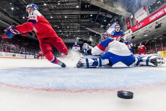 Pavel Simek of Czech Republic scores 2-0 behind goaltender