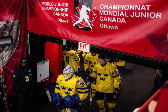 Goaltender Melker Thelin and Axel Hurtig of Sweden