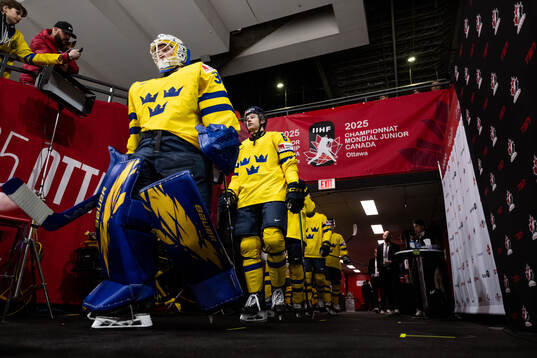 Goaltender Melker Thelin and Axel Hurtig of Sweden