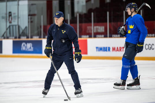 Head coach Magnus Hävelid and Anton Wahlberg of Sweden at