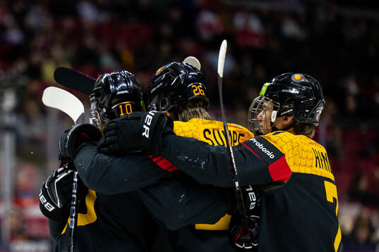 Simon Seidl of Germany celebrates with team mates