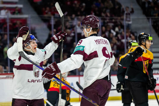 Bruno Osmanis and Eriks Mateiko of Latvia celebrate