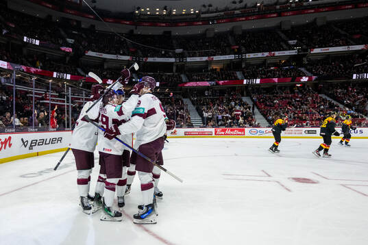 Eriks Mateiko of Latvia celebrates with team mates