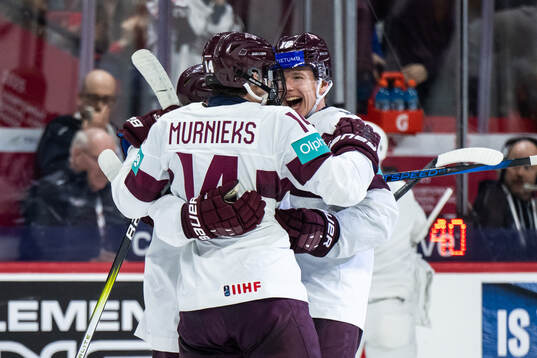 Olivers Murnieks of Latvia celebrates with Peteris Bulans