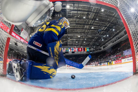 Goaltender Melker Thelin of Sweden looks dejected