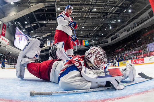 Matteo Koci and goaltender Michael Hrabal of Czech Republic