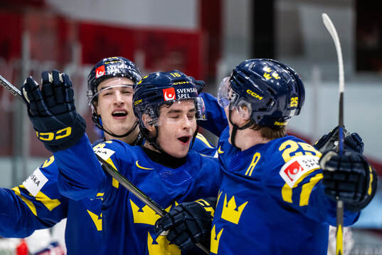 Felix Unger Sörum of Sweden celebrates with Otto Stenberg