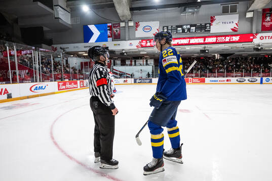 Anton Wahlberg of Sweden talks to a referee